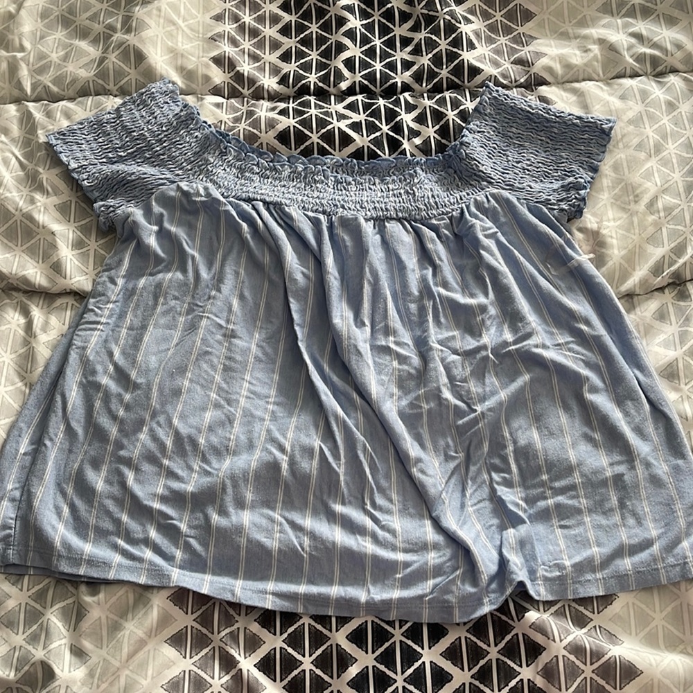 Off the shoulder, flowy short sleeve. Super cute, have worn a few times.
